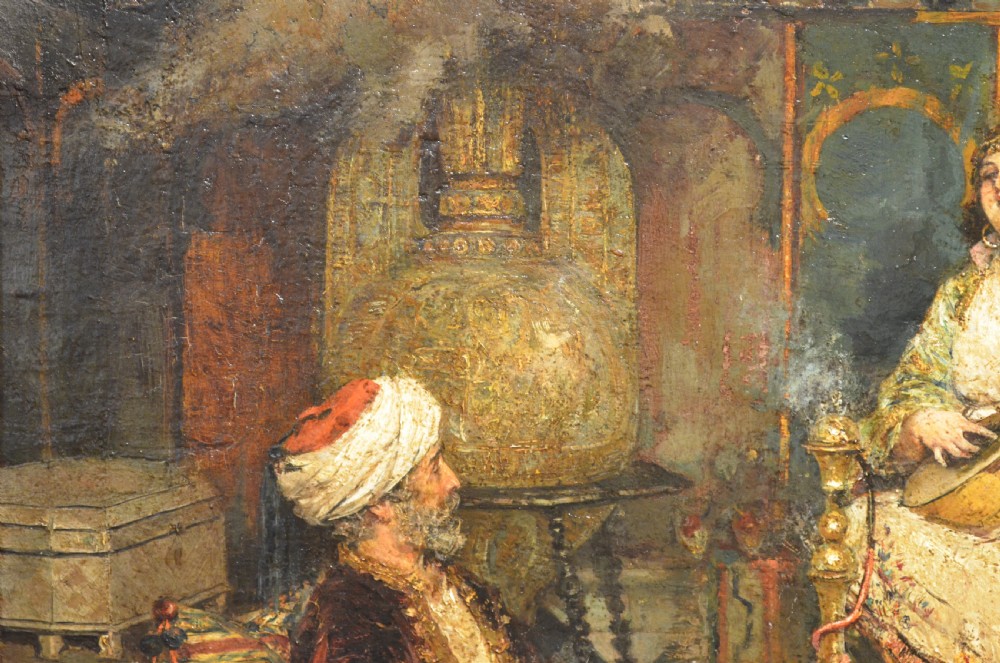 A framed 19th-century Orientalist oil painting on board featuring figures playing music and resting in a detailed interior scene. View V