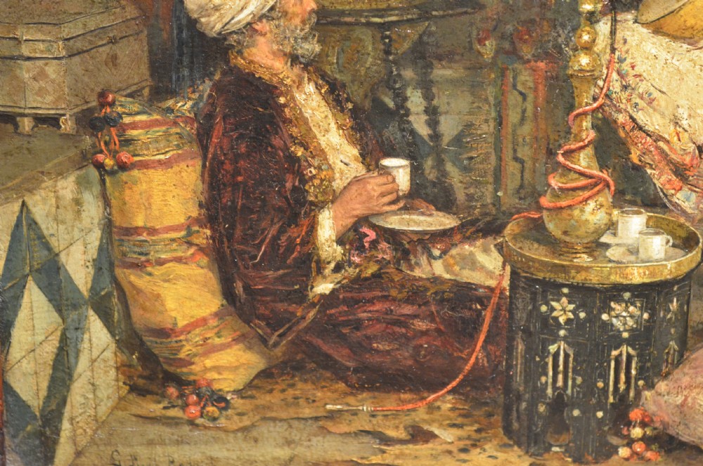 A framed 19th-century Orientalist oil painting on board featuring figures playing music and resting in a detailed interior scene. View VIII