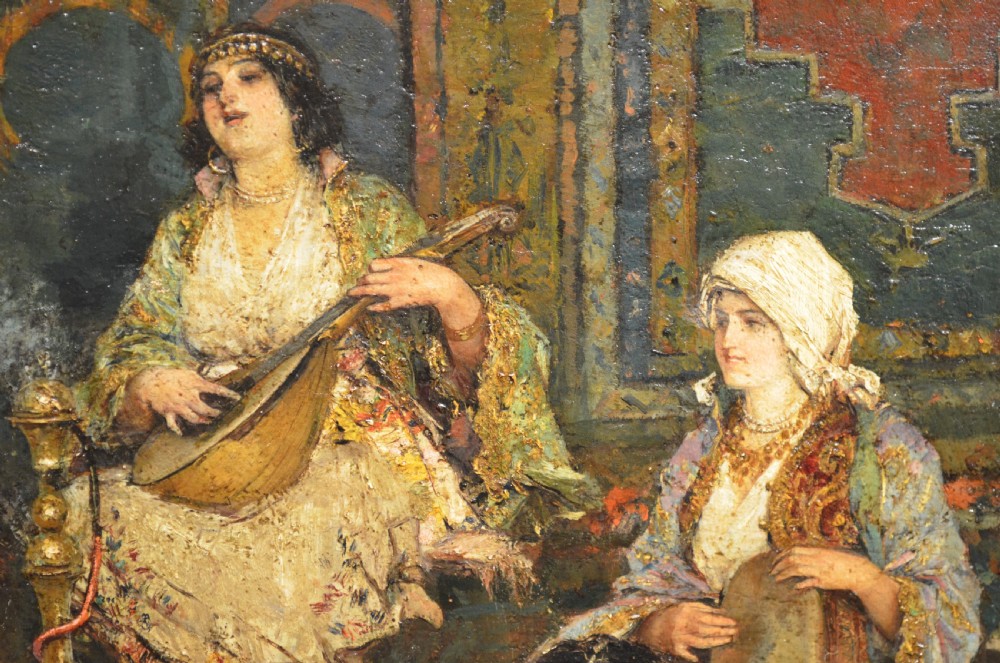 A framed 19th-century Orientalist oil painting on board featuring figures playing music and resting in a detailed interior scene. View XII