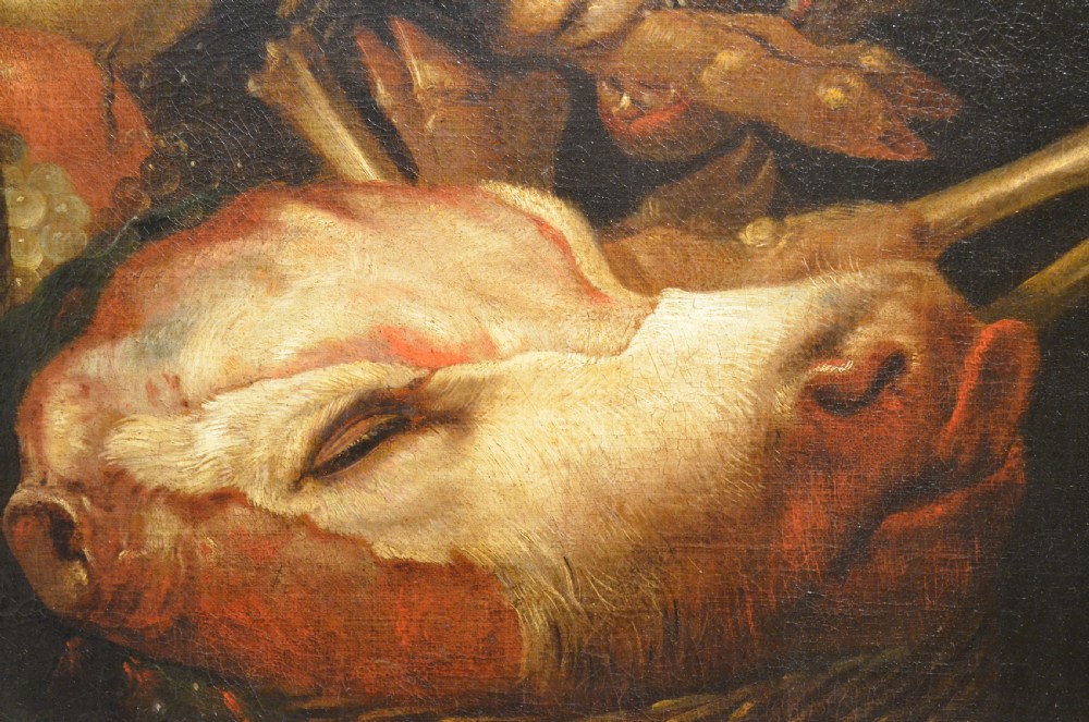 An oil painting depicting two dogs reaching into a woven basket containing meat and fruit, encased in an ornate gilded frame. View VIII