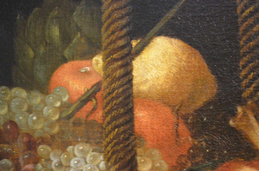 An oil painting depicting two dogs reaching into a woven basket containing meat and fruit, encased in an ornate gilded frame. View XVIII