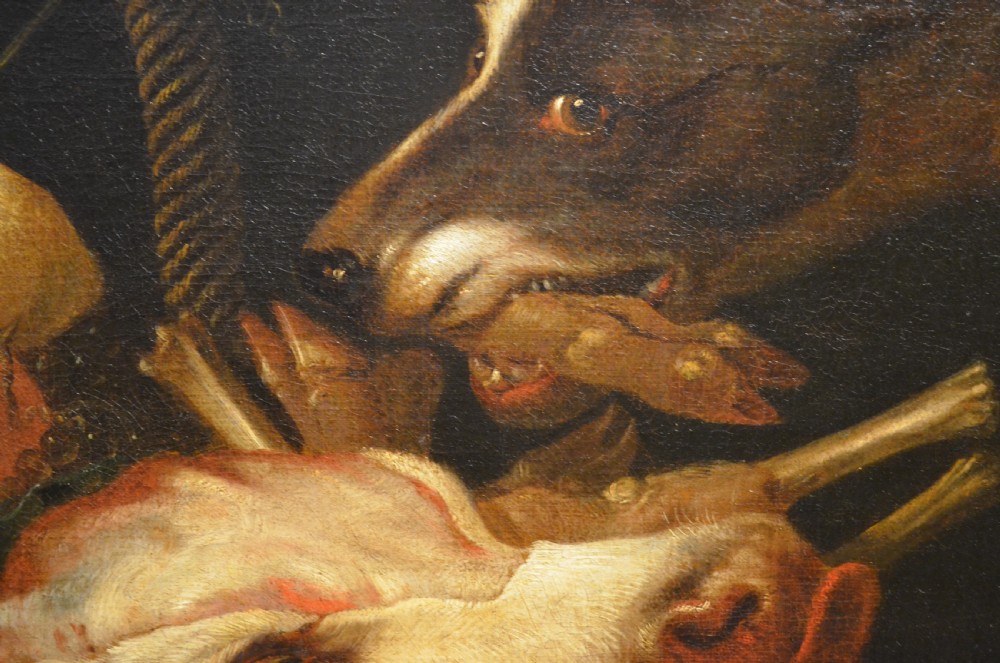 An oil painting depicting two dogs reaching into a woven basket containing meat and fruit, encased in an ornate gilded frame. View XIX