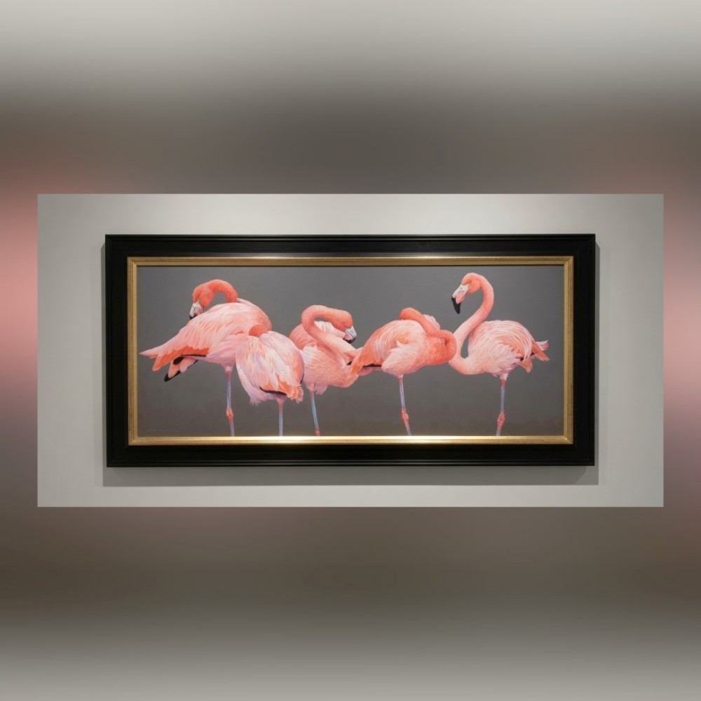 A wide panoramic oil painting on board depicting five pink flamingos in detailed poses against a grey background, encased in a black and gilt wooden frame. View II