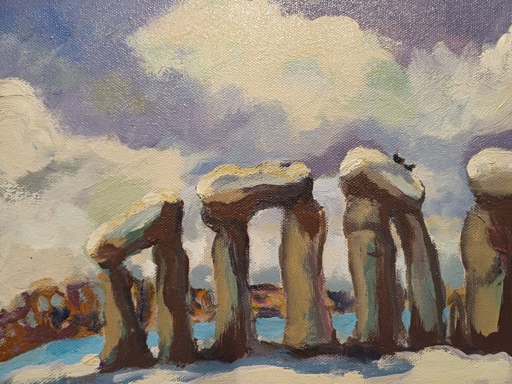 A framed original oil painting depicting the Heel Stone and Stonehenge covered in snow under a cloudy sky with two crows in the foreground. View VI