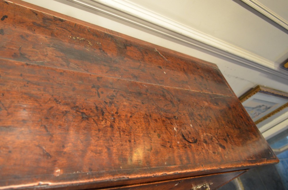 A Georgian solid oak dresser base featuring three drawers with brass swan-neck handles, supported by four straight square legs. View IX