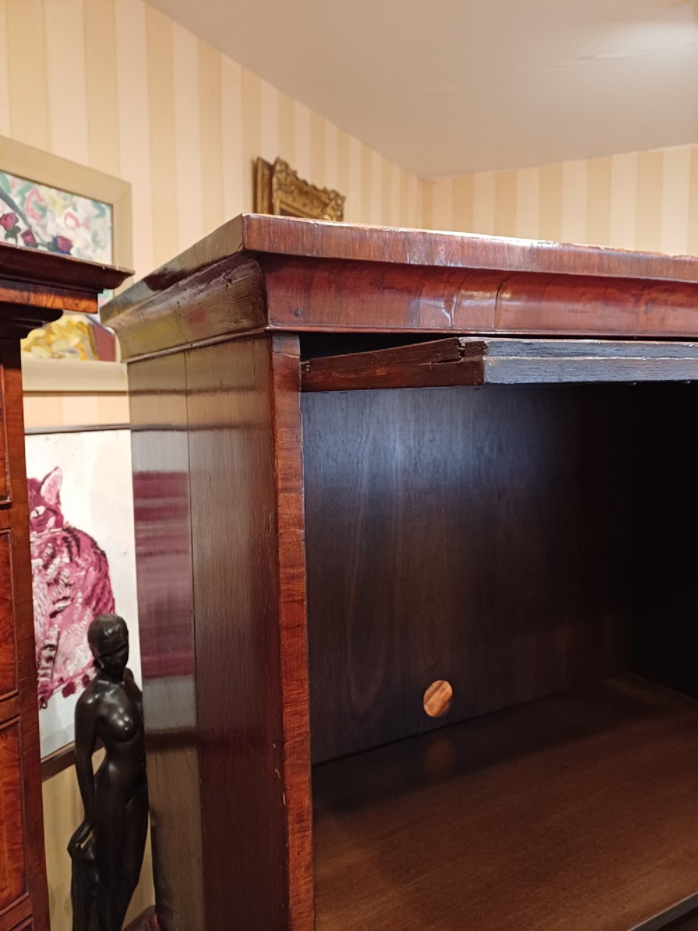 An early eighteenth-century walnut chest on chest featuring crossbanded drawers, brass handles, and bracket feet. View XI