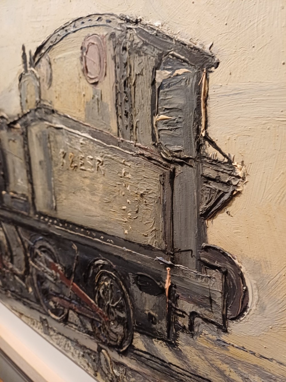 An original oil painting on board depicting a dark grey and red side tank steam locomotive sitting on railway tracks, presented in a light wooden frame with a wide mount. View II