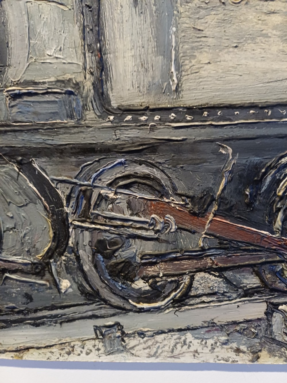 An original oil painting on board depicting a dark grey and red side tank steam locomotive sitting on railway tracks, presented in a light wooden frame with a wide mount. View IV