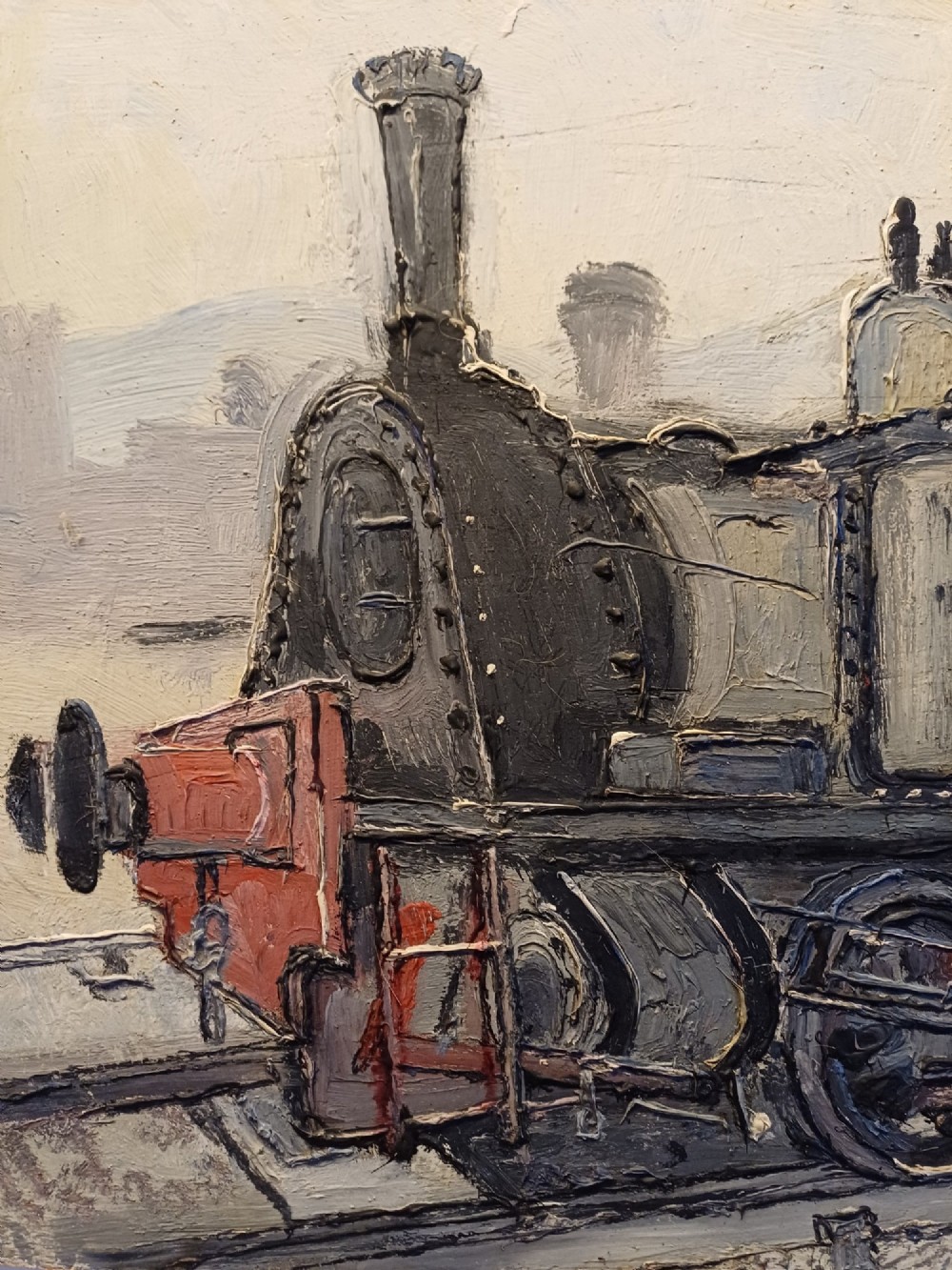 An original oil painting on board depicting a dark grey and red side tank steam locomotive sitting on railway tracks, presented in a light wooden frame with a wide mount. View XIII