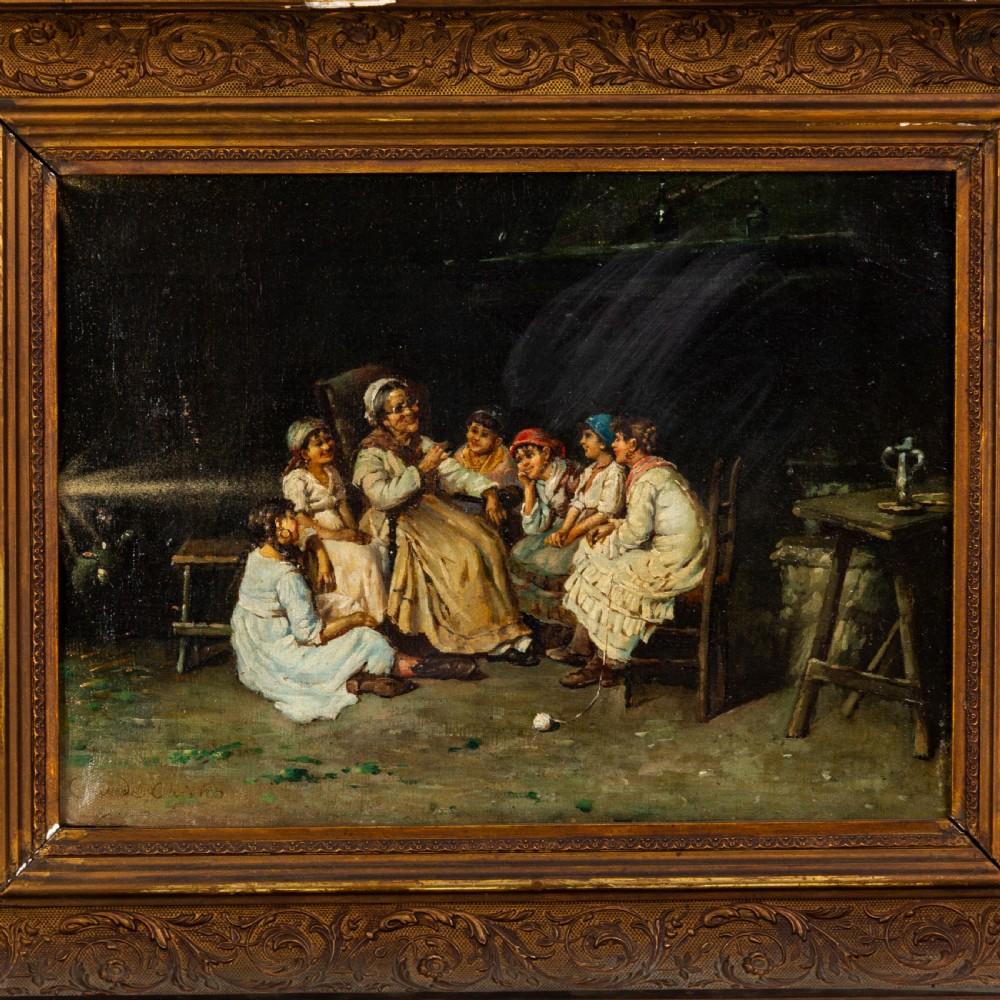 A nineteenth-century oleograph depicting an interior genre scene with figures gathered around a seated woman, set within a heavy moulded gold giltwood frame. View II