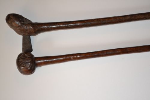 Two 19th Century African Tribal Clubs. Ceremonial Zulu Knobkerrie with Carved Bulbous End and Carved Wood Club with Metal Blade, C1890