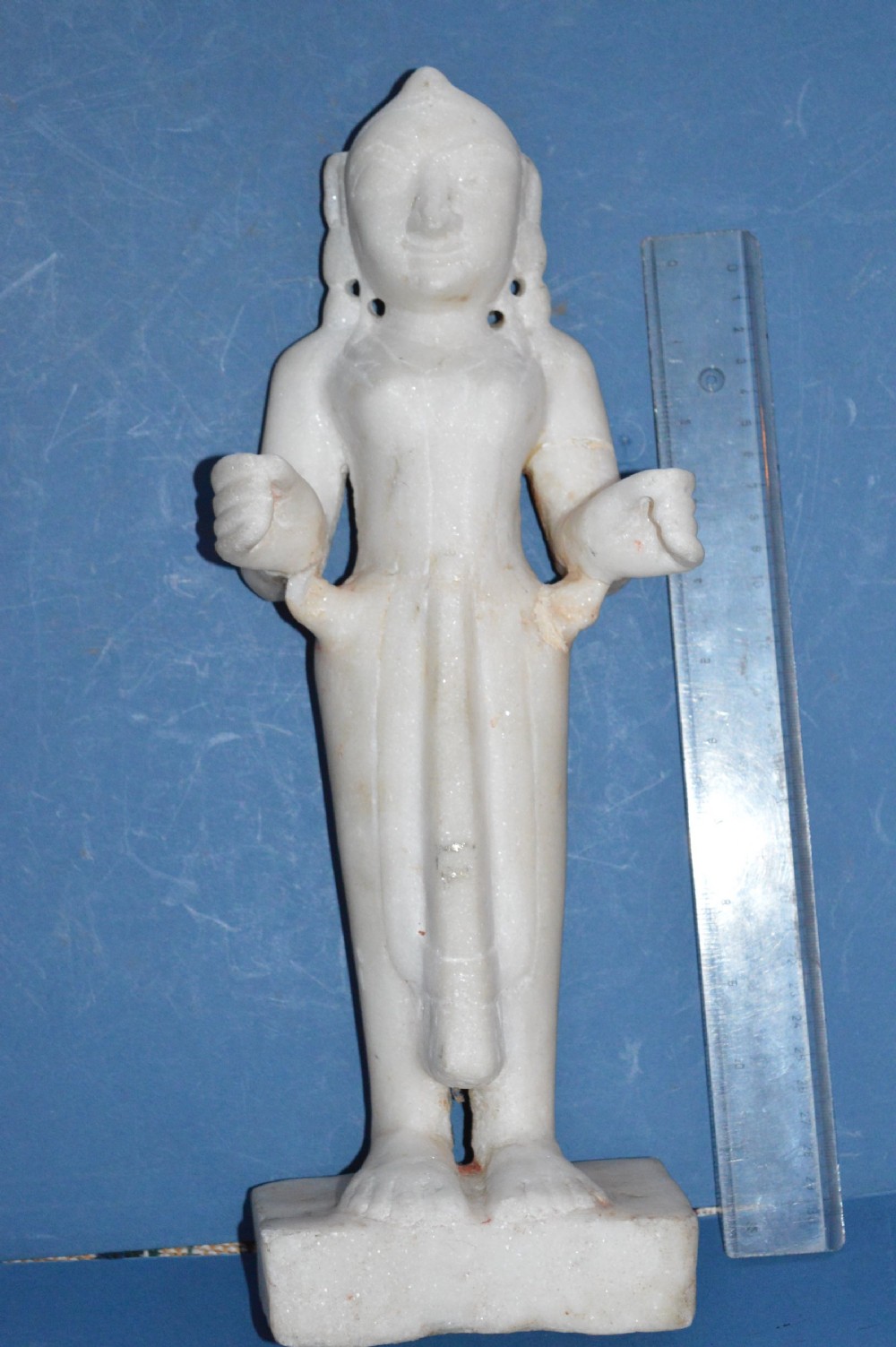 A carved white alabaster standing religious statue with hand-carved drapery details and a smooth finish. View II