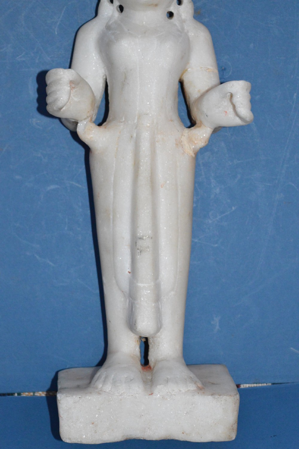A carved white alabaster standing religious statue with hand-carved drapery details and a smooth finish. View III