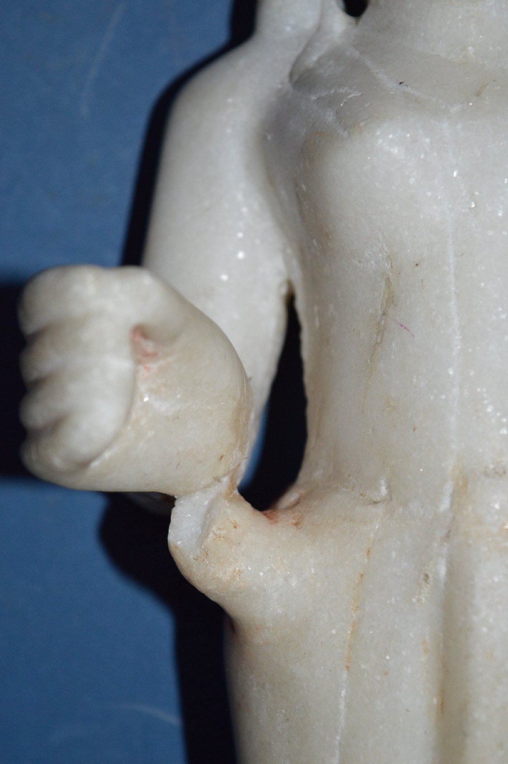 A carved white alabaster standing religious statue with hand-carved drapery details and a smooth finish. View V