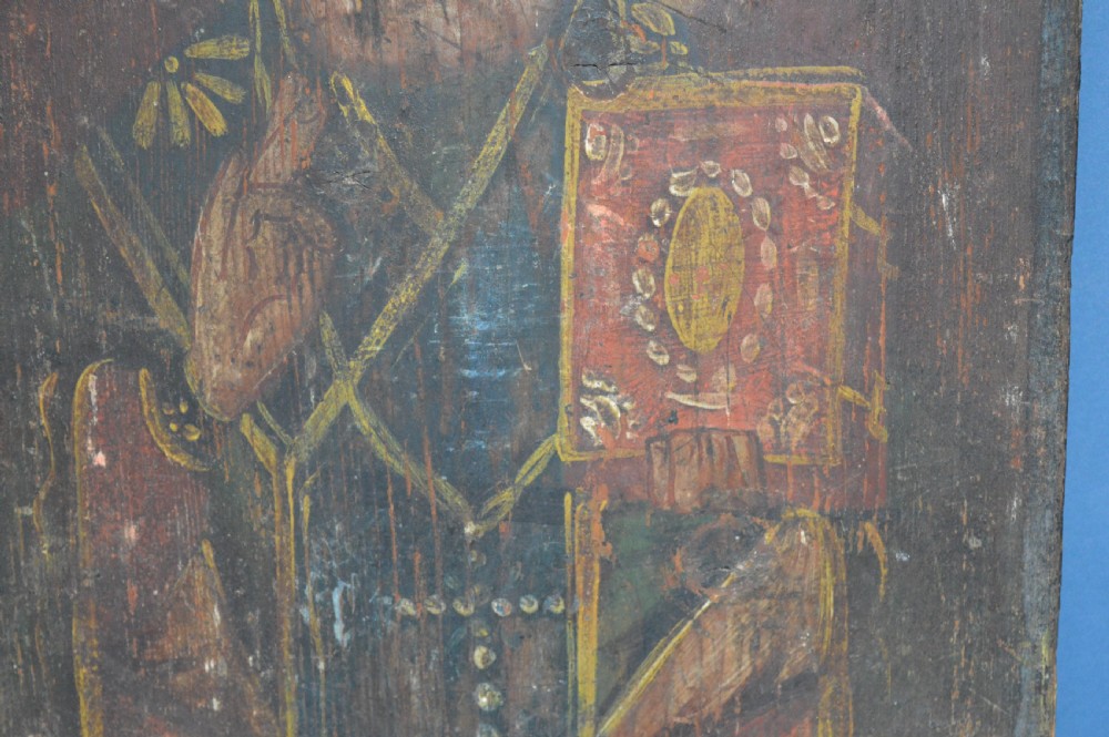 An antique hand-painted Russian wooden icon depicting a religious figure with a halo and holding a scripture book. View III