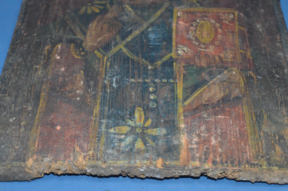 An antique hand-painted Russian wooden icon depicting a religious figure with a halo and holding a scripture book. View VIII