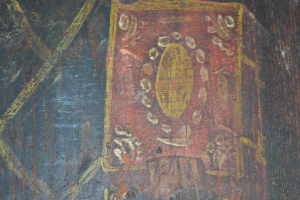 An antique hand-painted Russian wooden icon depicting a religious figure with a halo and holding a scripture book. View XIII