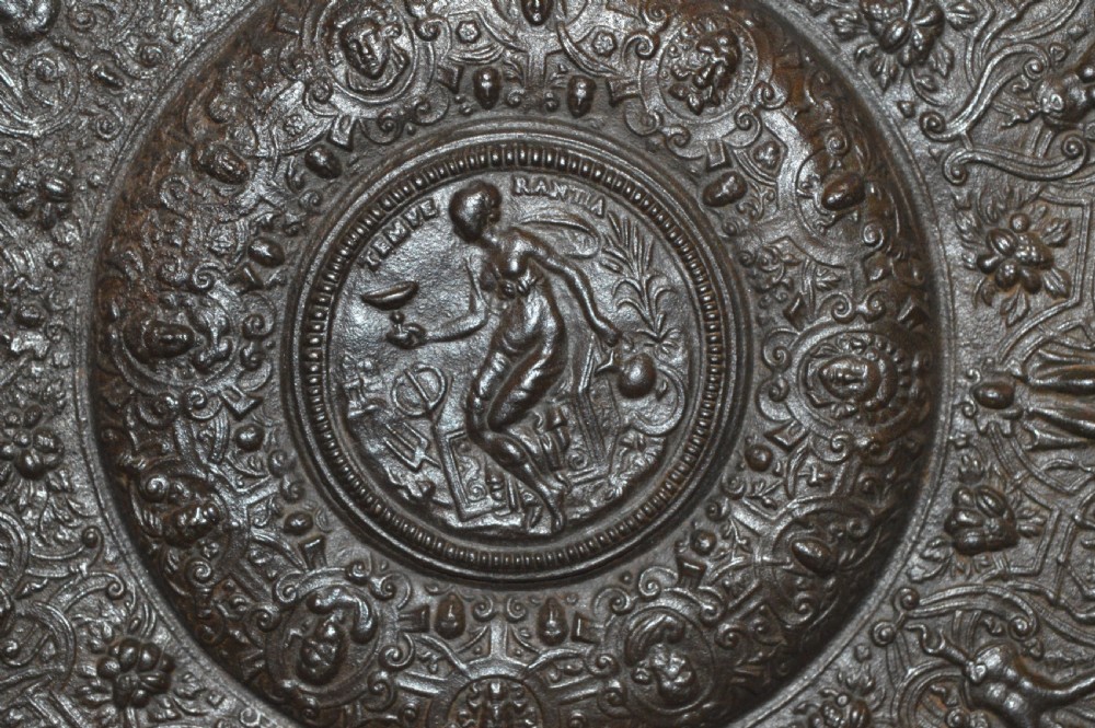A large circular dark bronze charger featuring concentric bands of classical relief figures surrounding a central classical medallion. View VI