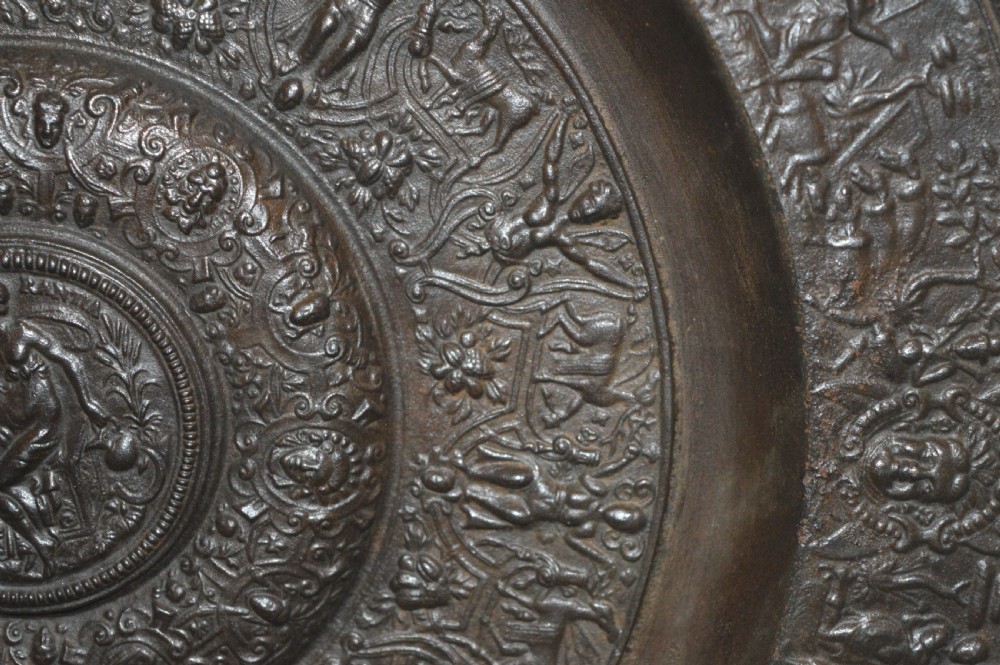 A large circular dark bronze charger featuring concentric bands of classical relief figures surrounding a central classical medallion. View VIII