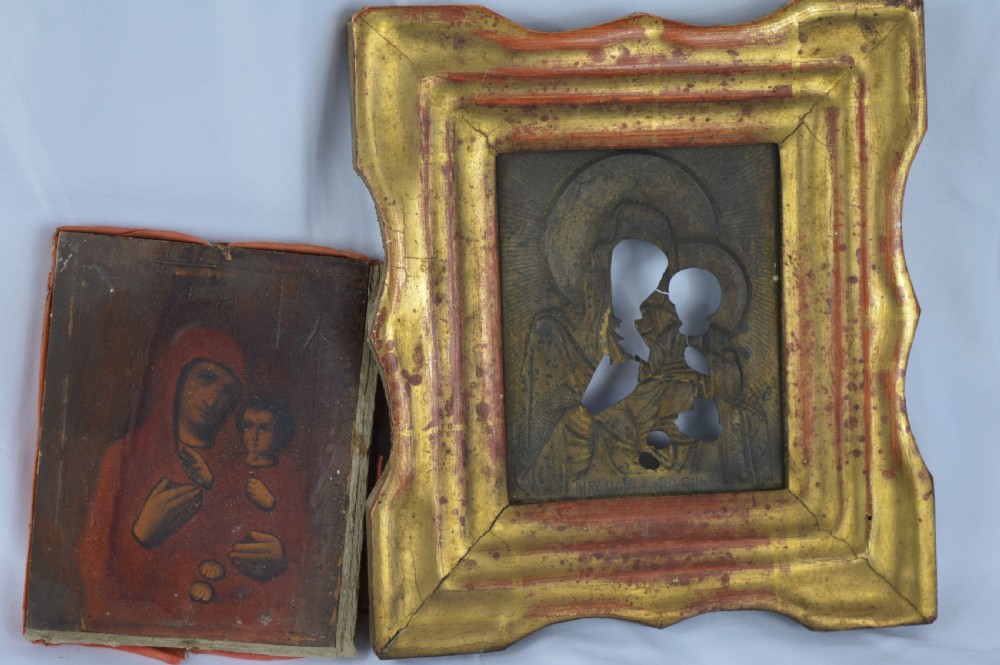 An early 20th-century Russian Orthodox icon depicting the Virgin Mary and Christ Child inside a carved, gilded wooden frame. View III