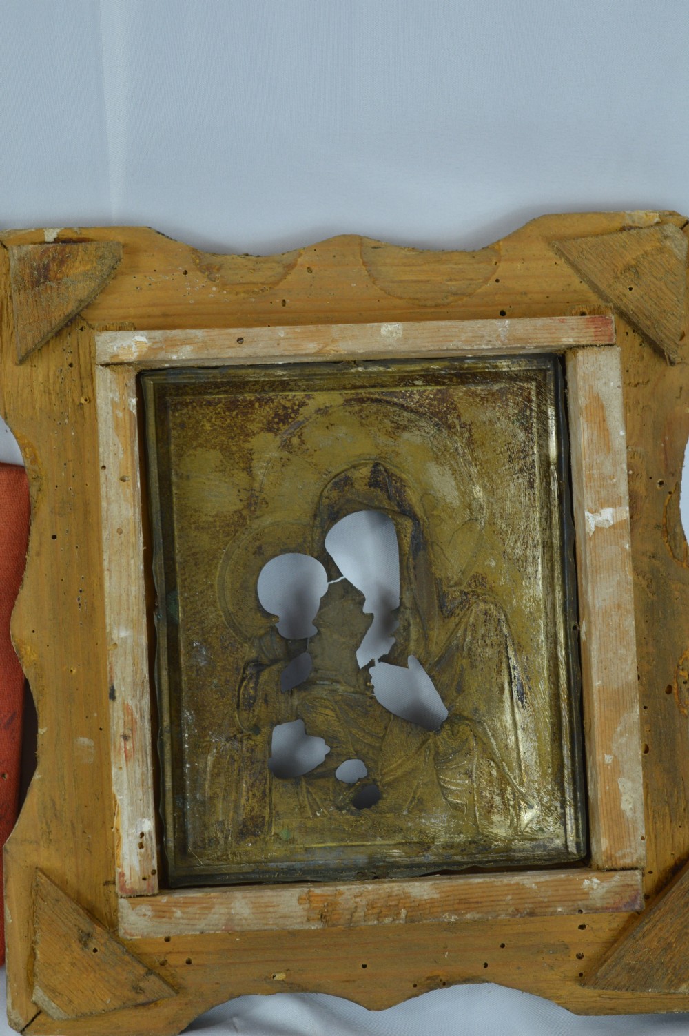 An early 20th-century Russian Orthodox icon depicting the Virgin Mary and Christ Child inside a carved, gilded wooden frame. View VII