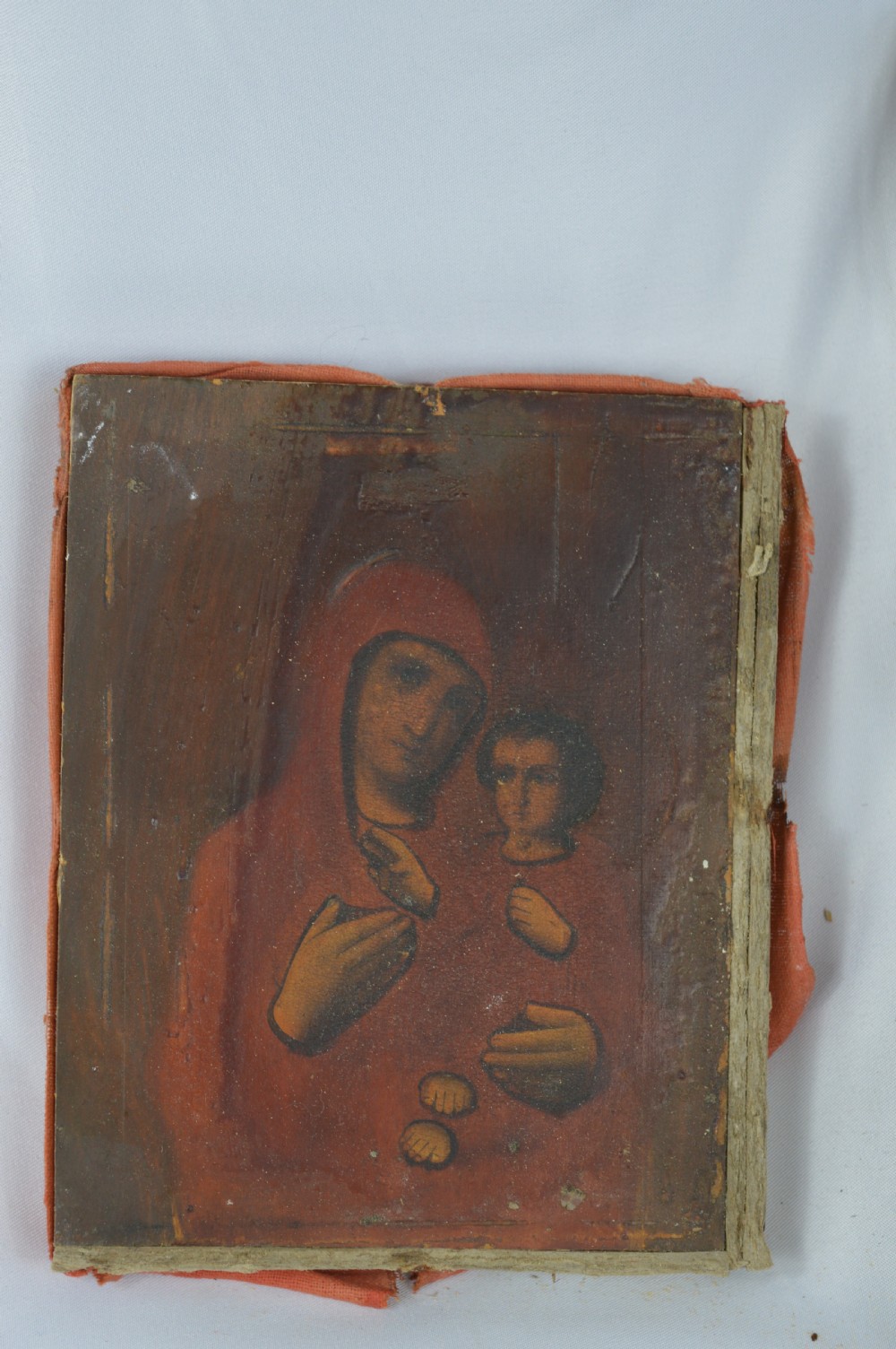 An early 20th-century Russian Orthodox icon depicting the Virgin Mary and Christ Child inside a carved, gilded wooden frame. View XIII