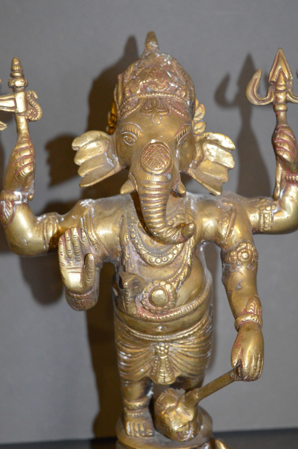 A late 19th-century cast bronze standing Lord Ganesha statue mounted on a lotus pedestal with a small rodent figure at the base. View II