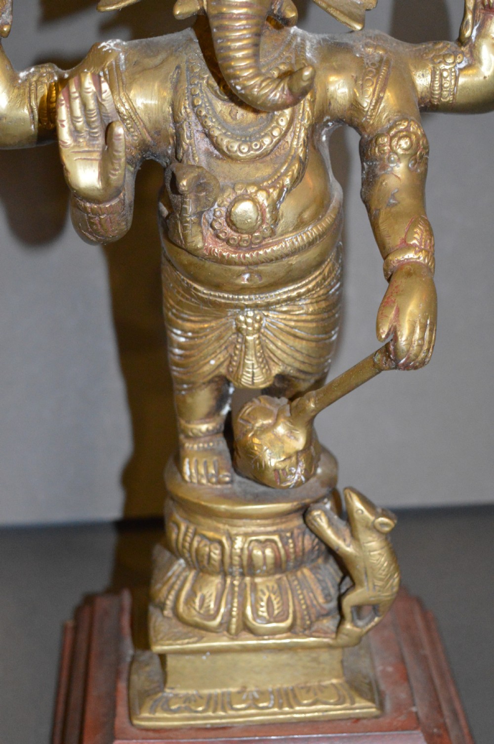A late 19th-century cast bronze standing Lord Ganesha statue mounted on a lotus pedestal with a small rodent figure at the base. View III