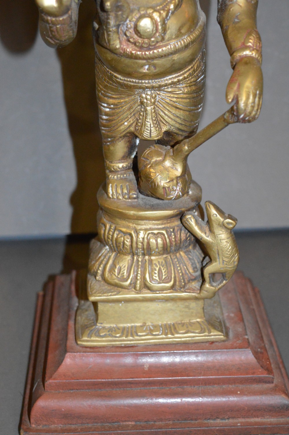 A late 19th-century cast bronze standing Lord Ganesha statue mounted on a lotus pedestal with a small rodent figure at the base. View IV