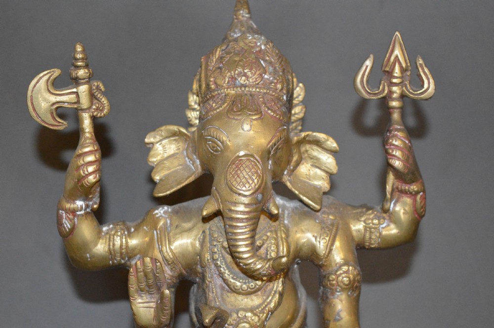A late 19th-century cast bronze standing Lord Ganesha statue mounted on a lotus pedestal with a small rodent figure at the base. View VI