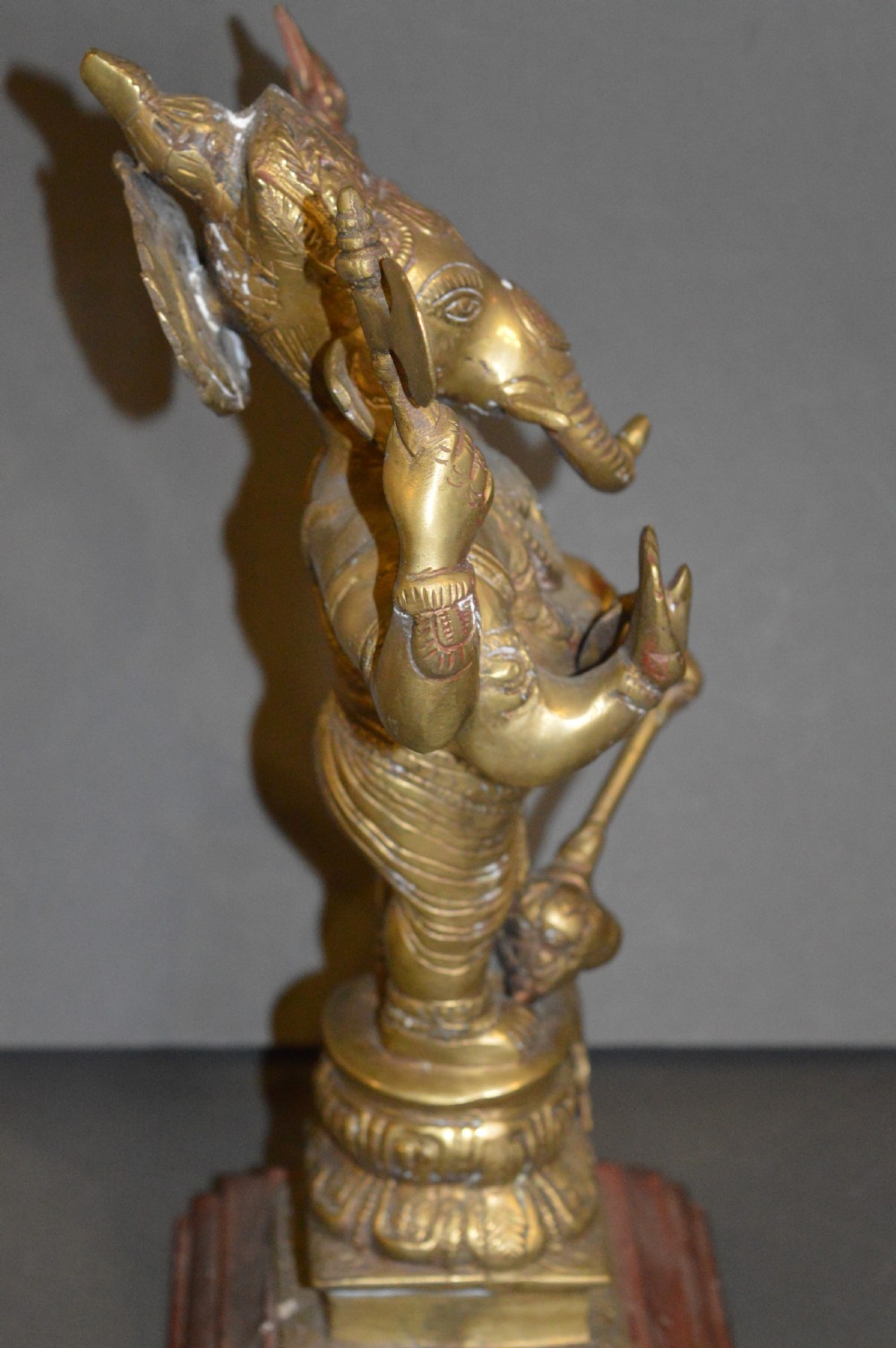 A late 19th-century cast bronze standing Lord Ganesha statue mounted on a lotus pedestal with a small rodent figure at the base. View VII