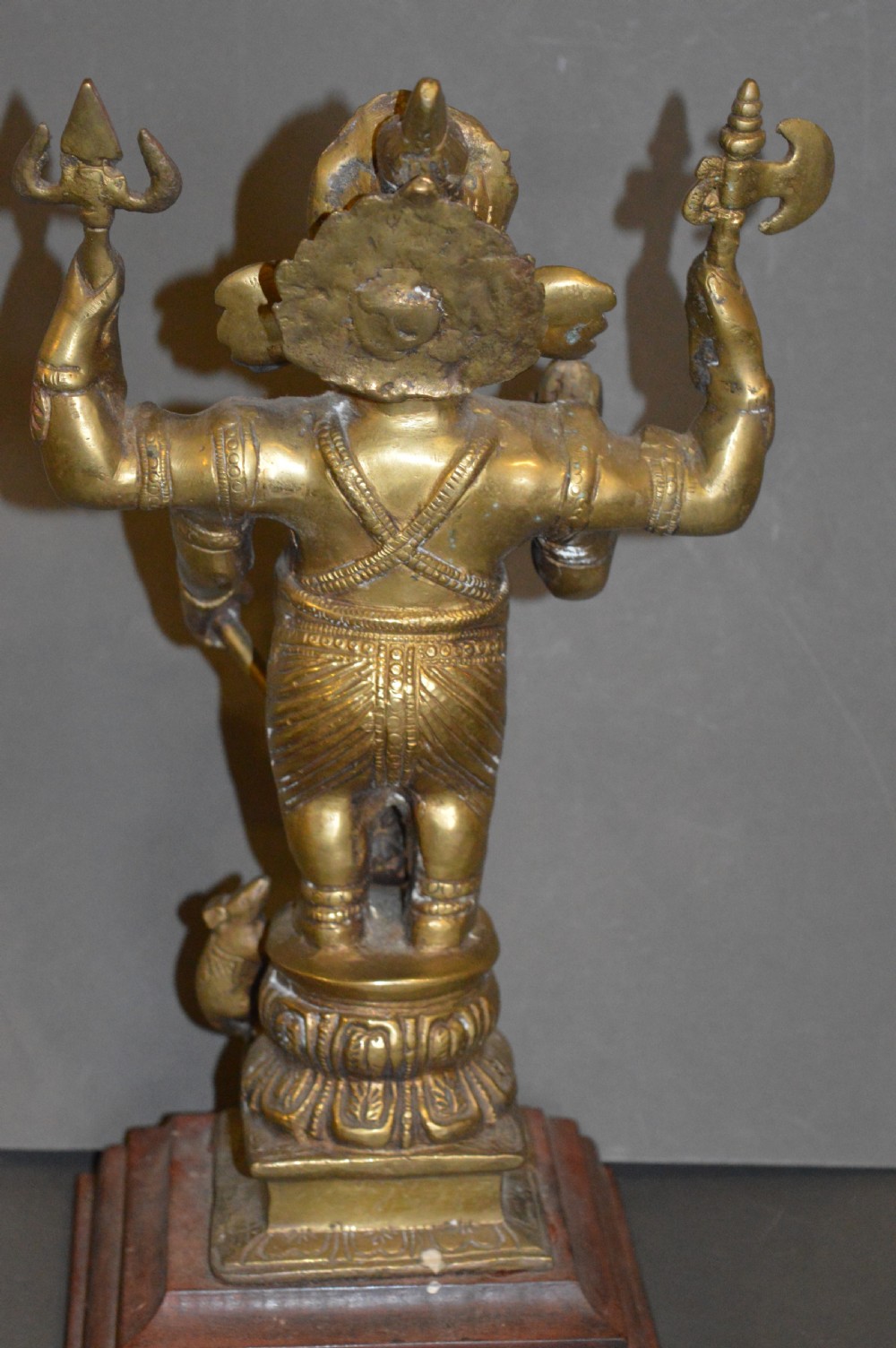 A late 19th-century cast bronze standing Lord Ganesha statue mounted on a lotus pedestal with a small rodent figure at the base. View VIII