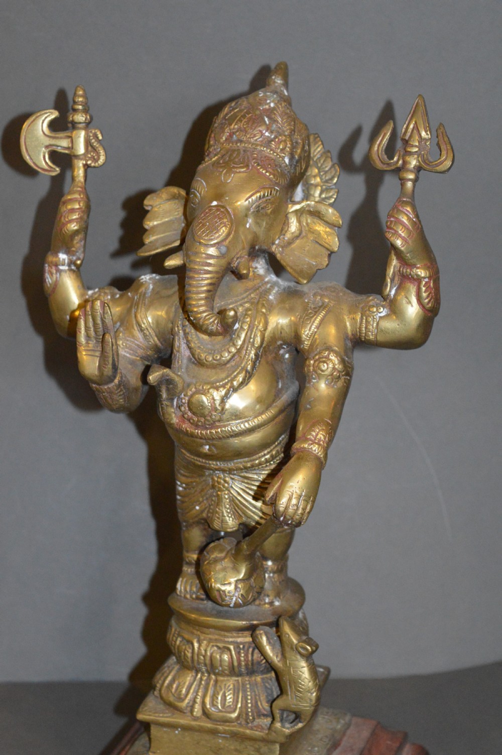 A late 19th-century cast bronze standing Lord Ganesha statue mounted on a lotus pedestal with a small rodent figure at the base. View X