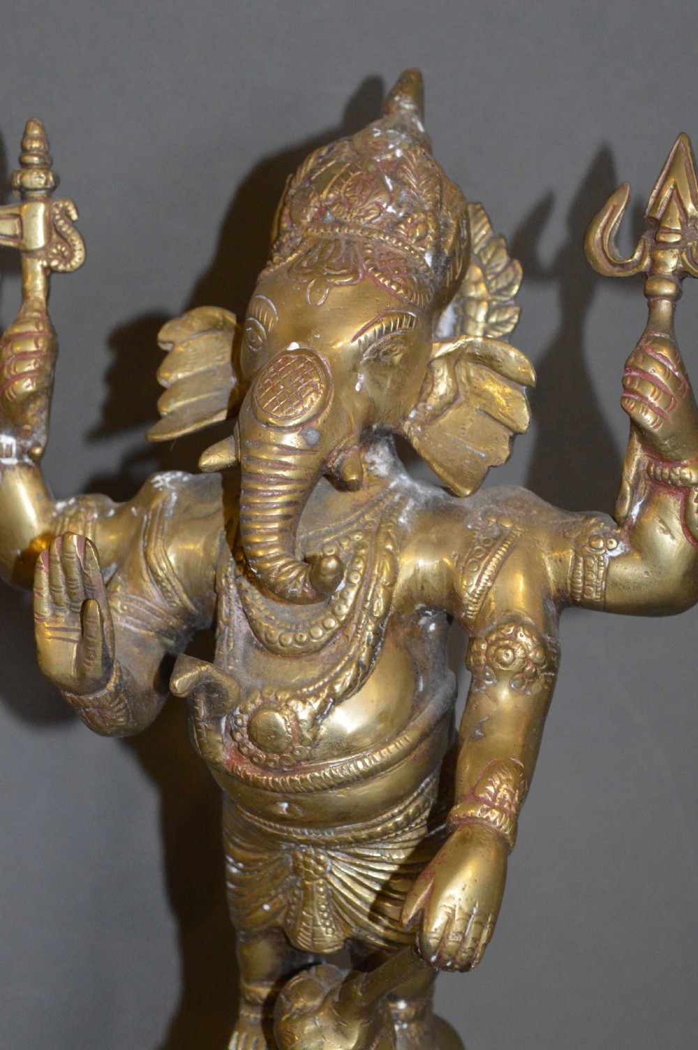 A late 19th-century cast bronze standing Lord Ganesha statue mounted on a lotus pedestal with a small rodent figure at the base. View XI