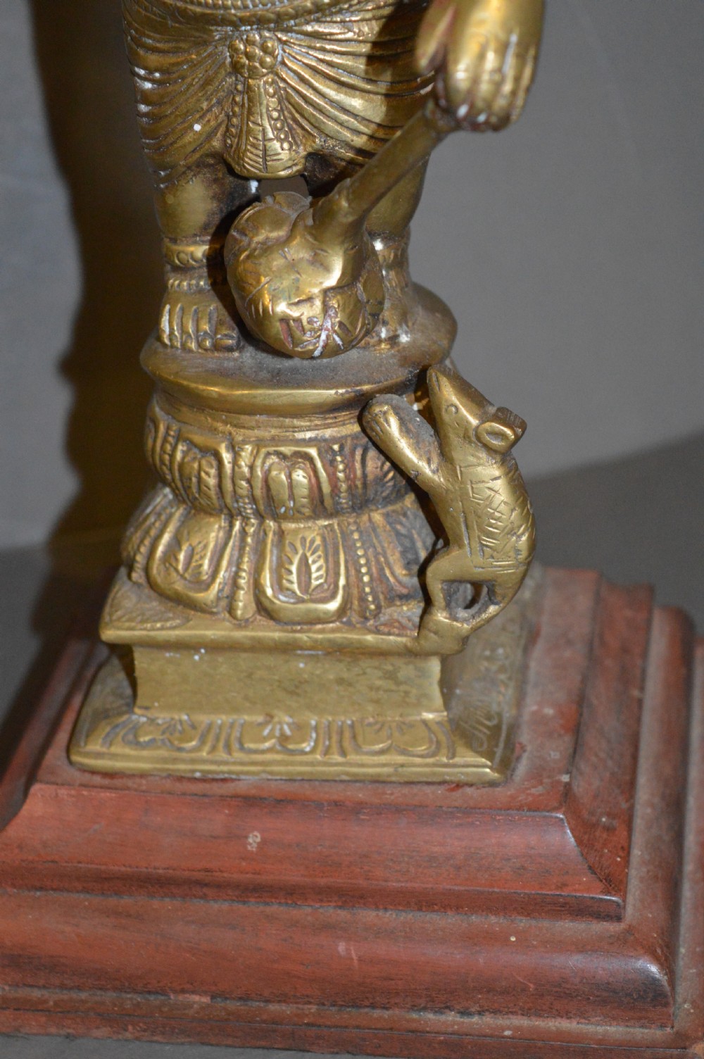 A late 19th-century cast bronze standing Lord Ganesha statue mounted on a lotus pedestal with a small rodent figure at the base. View XII