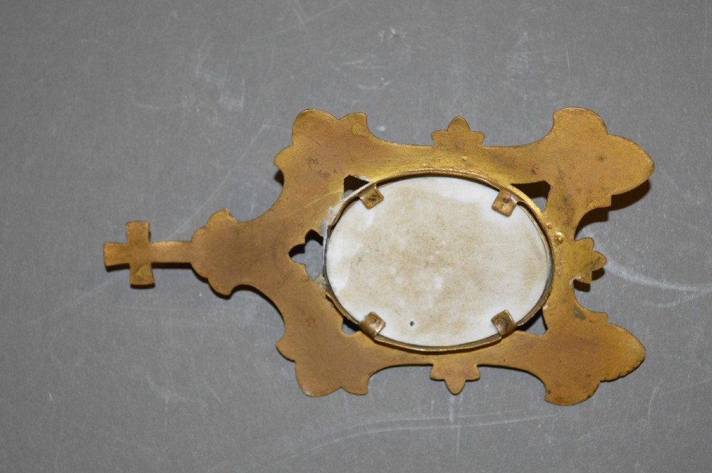 A set of three late nineteenth-century Spanish brass devotional items, including two Caravaca double-barred crosses with angel figures and one central hinged miniature shrine. View XI