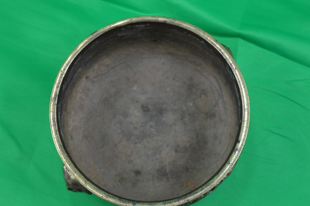A late 19th-century Chinese cast bronze incense censer featuring raised relief Chinese character panels and side handles formed as lion masks. View VI
