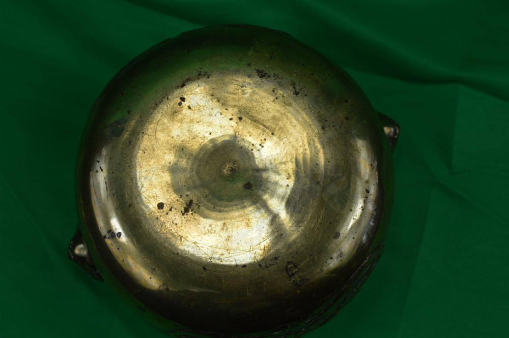A late 19th-century Chinese cast bronze incense censer featuring raised relief Chinese character panels and side handles formed as lion masks. View VII