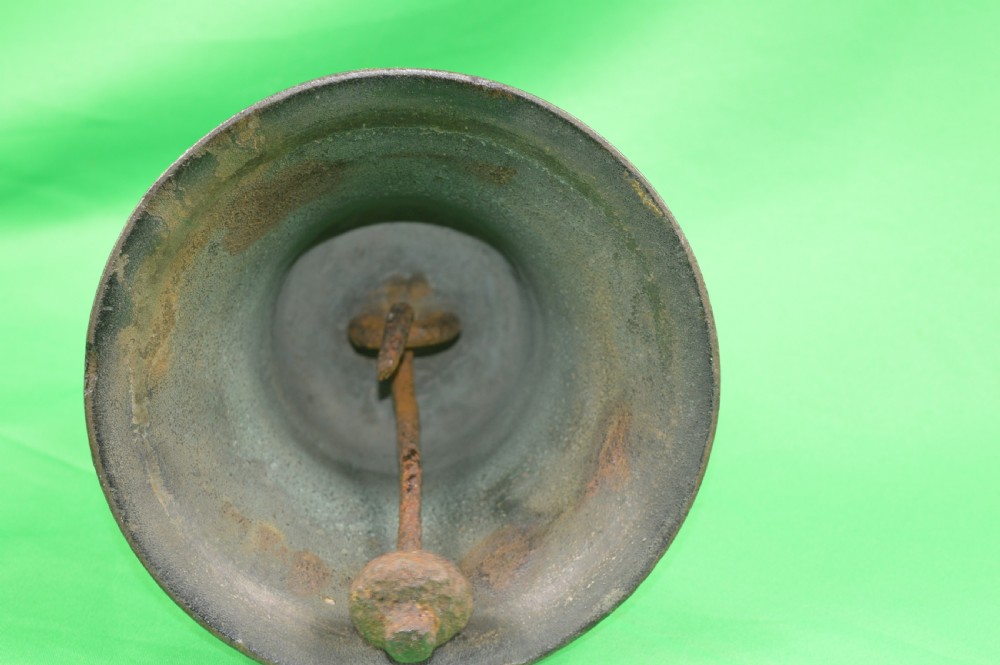 A nineteenth-century cast bronze ships bell featuring a dark aged patina, subtle molded body ring detailing, and an upper mounting lug. View IV