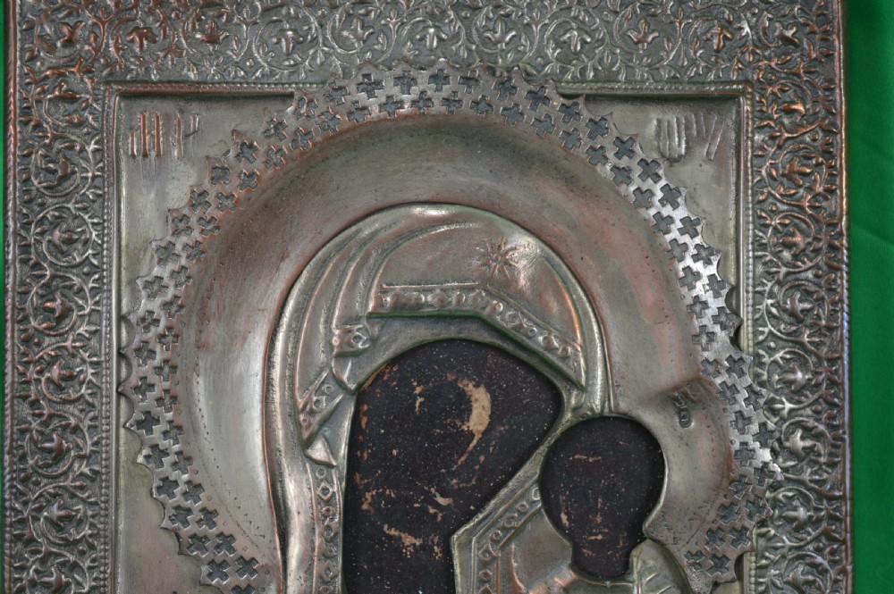 A late nineteenth-century Russian Orthodox icon depicting the Virgin Mary and Child beneath a chased metal oklad cover. View III