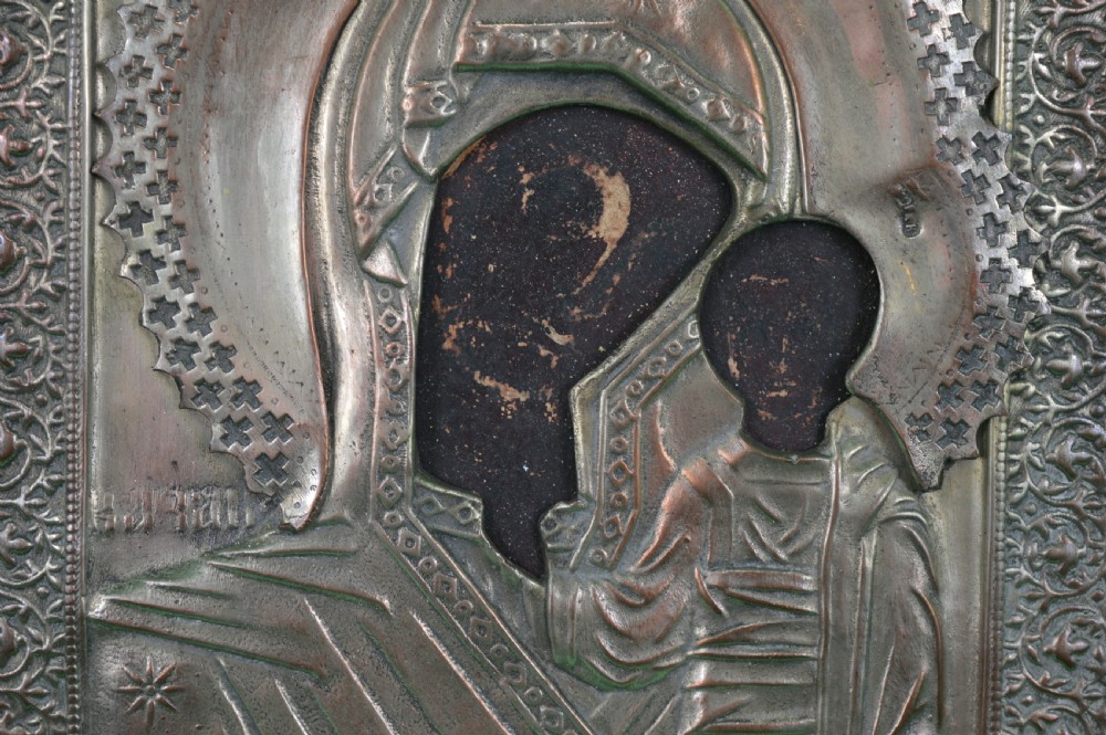 A late nineteenth-century Russian Orthodox icon depicting the Virgin Mary and Child beneath a chased metal oklad cover. View IV