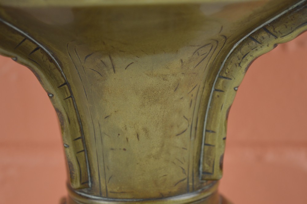 A cast bronze trumpet-shaped Chinese Gu vase with vertical flanges, a bulbous central section, and incised archaic pattern detailing. View VI