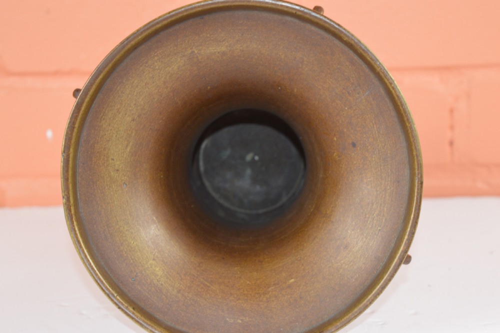 A cast bronze trumpet-shaped Chinese Gu vase with vertical flanges, a bulbous central section, and incised archaic pattern detailing. View VII