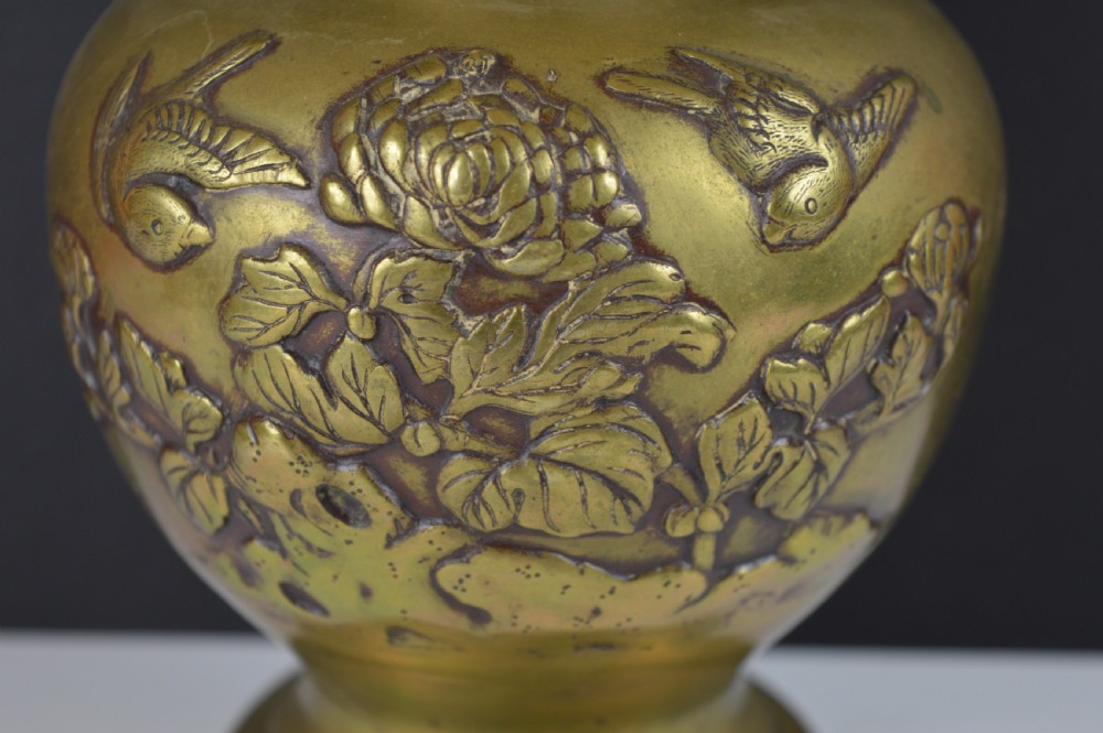 A cast bronze baluster vase featuring relief depictions of birds and flowers with bird-shaped side handles. View IV