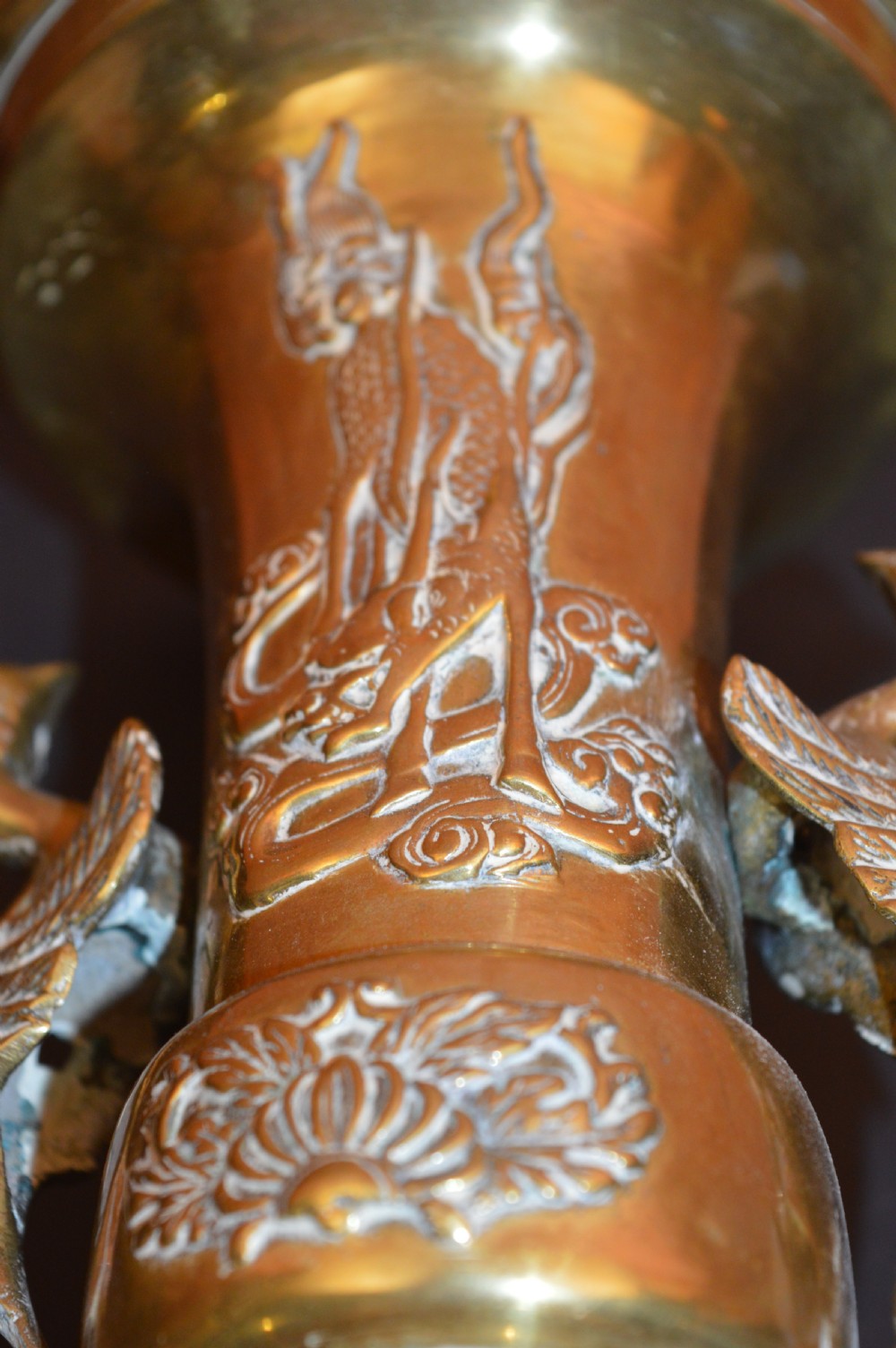 A nineteenth-century Chinese bronze vase featuring bird-shaped handles and intricate relief-carved floral motifs on a flared baluster body. View VII
