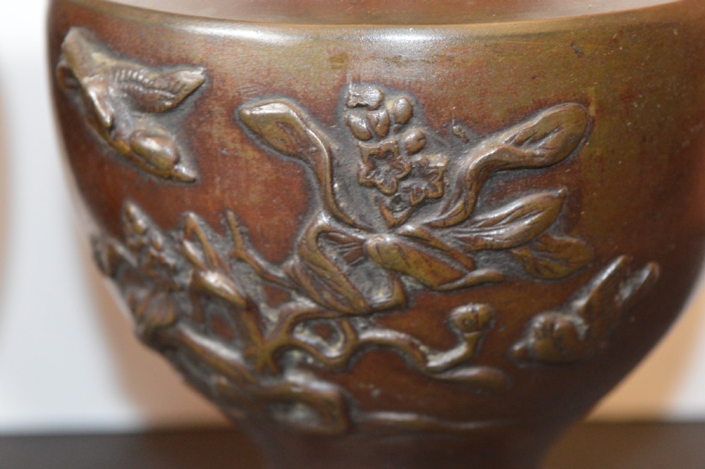 A pair of patinated dark brown Chinese bronze altar vases featuring sculpted dragon handles and low-relief carvings of birds and floral motifs. View VII