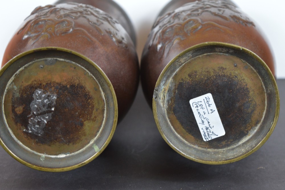 A pair of patinated dark brown Chinese bronze altar vases featuring sculpted dragon handles and low-relief carvings of birds and floral motifs. View XIV