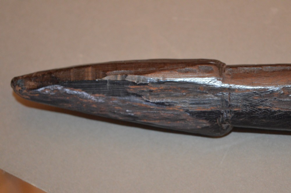 A late 19th-century Polynesian hardwood paddle club featuring a carved central ridge running along the length of its elongated blade section. View VII