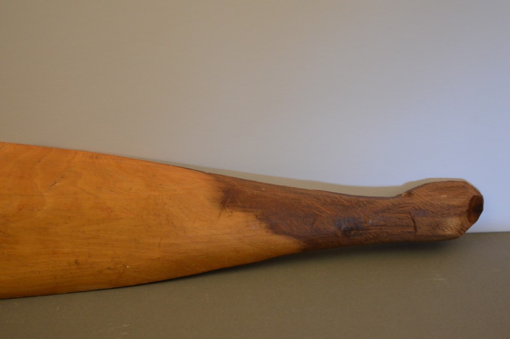 A pair of 19th-century carved Indigenous Australian wooden woomeras displaying elongated curved profiles and natural timber grain. View XII