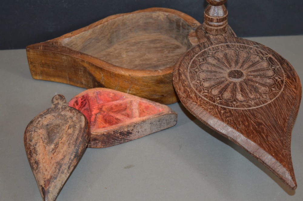 Pair of 19th-century Indian hand-carved teardrop-shaped hardwood spice boxes featuring intricate floral rosette motifs and a turned wood knob. View II